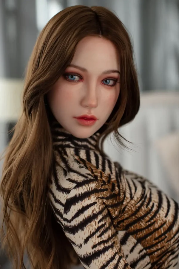 A d-cup life size hyper realistic sex doll wears a leopard print top.