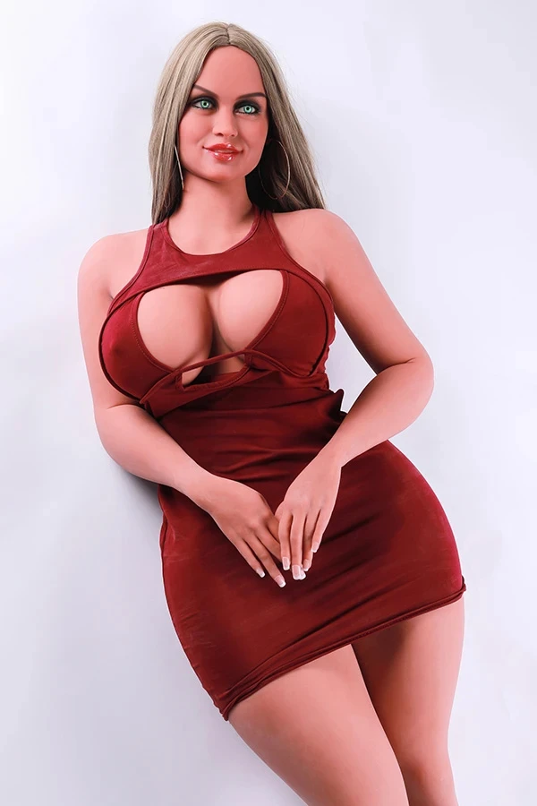 A milf fat mature chubby big boobs sex doll stands on the ground, wearing a red dress.