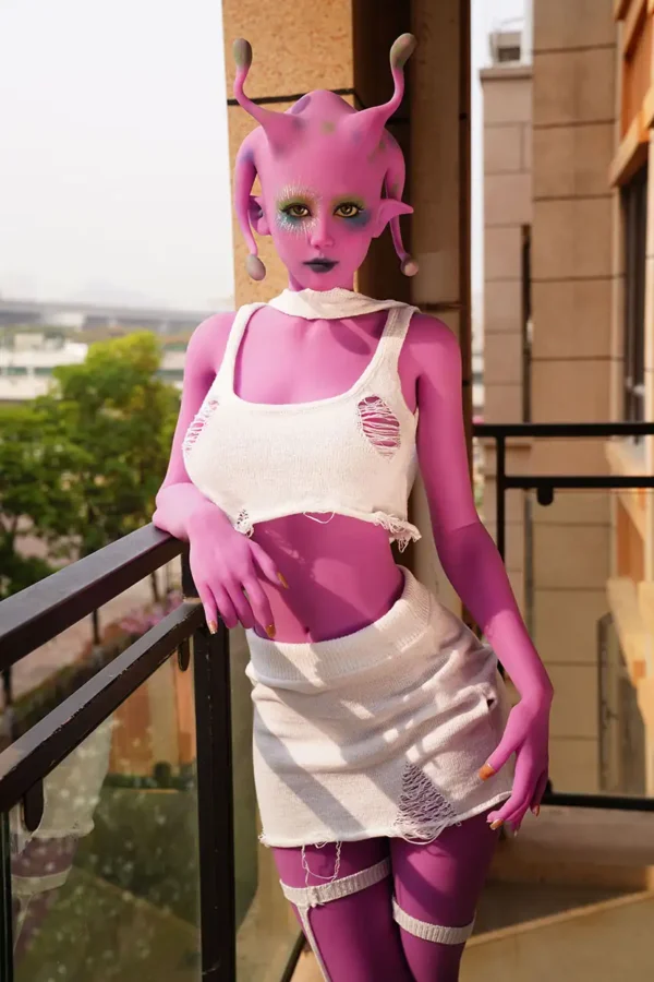 A purple alien E-cup life size sex doll stands on the ground, wearing a white set.